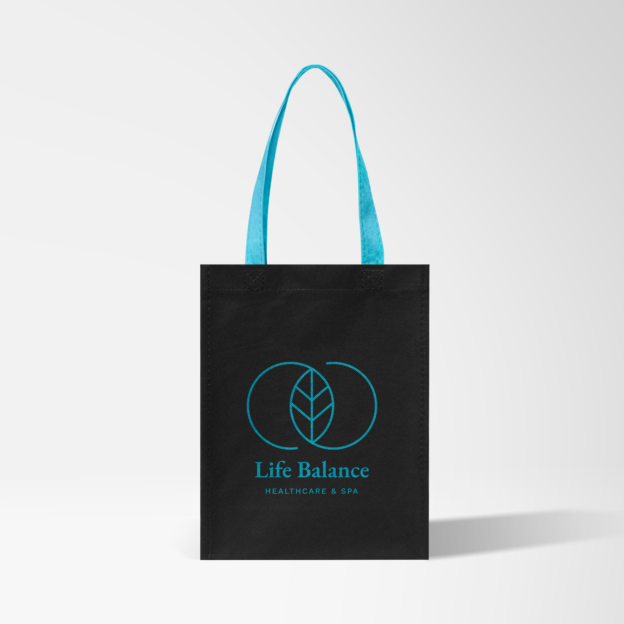 Pink promotional tote bag with black logo printed on display.