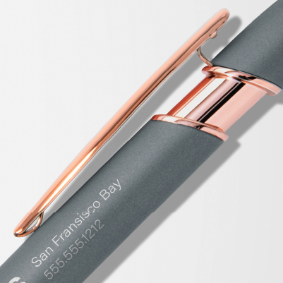Custom metal rose gold pen with business name and number.
